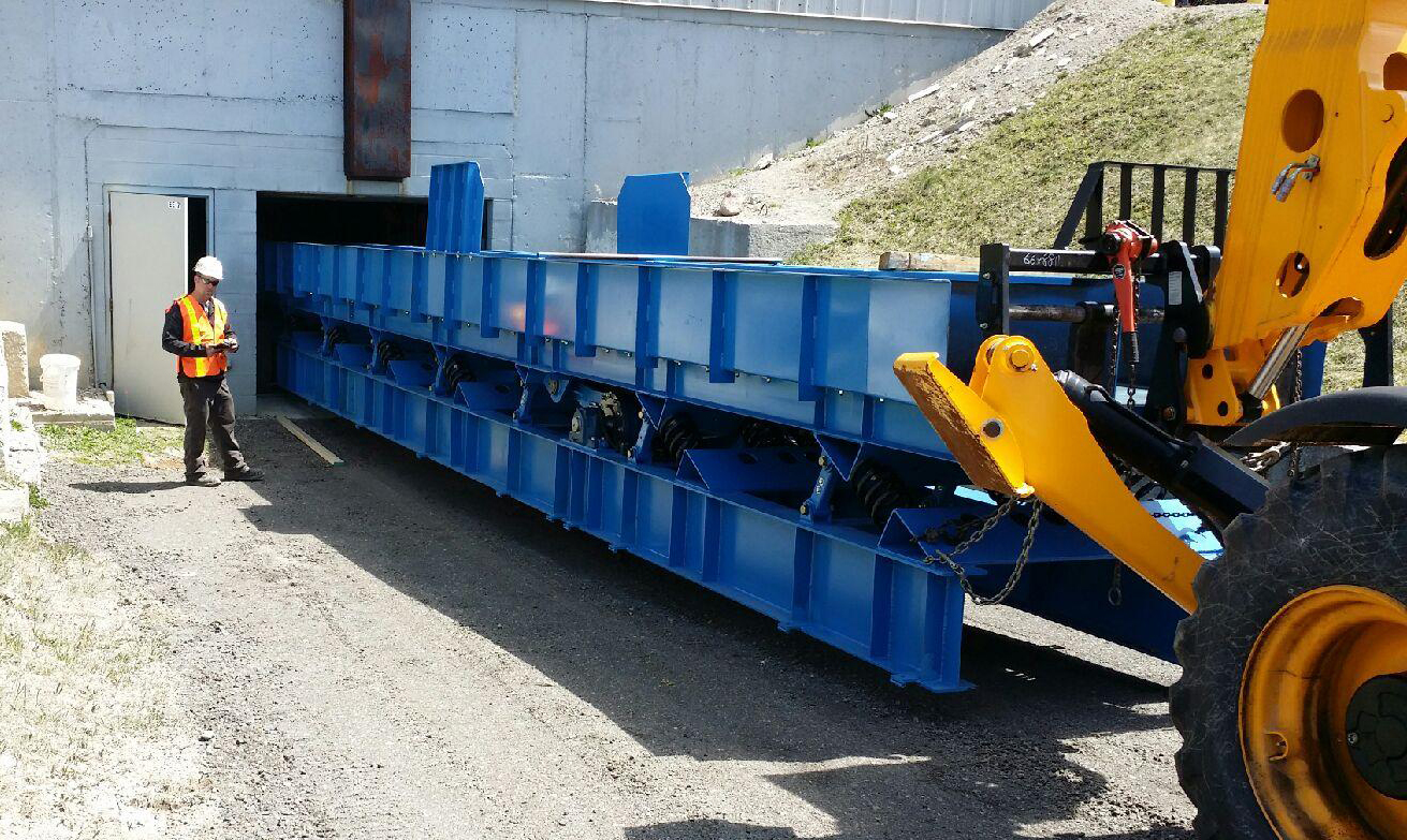 our team installing a large vibrating conveyor we built